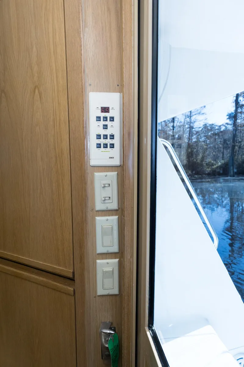 Slide: The Image of Control panel and switches inside a 1997 Hatteras 65 Convertible yacht. - 6