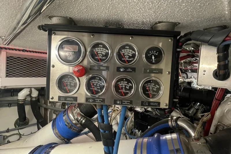 Slide: The Image of Engine control panel of a 1997 Hatteras 65 Convertible yacht. - 60