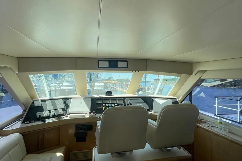 Slide: The Image of Interior helm of 1997 Hatteras 65 Convertible yacht with navigation equipment. - 65