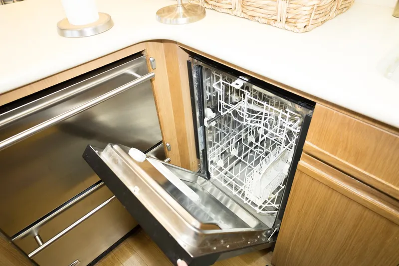 Slide: The Image of Open dishwasher in a 1997 Hatteras 65 Convertible yacht kitchen. - 8