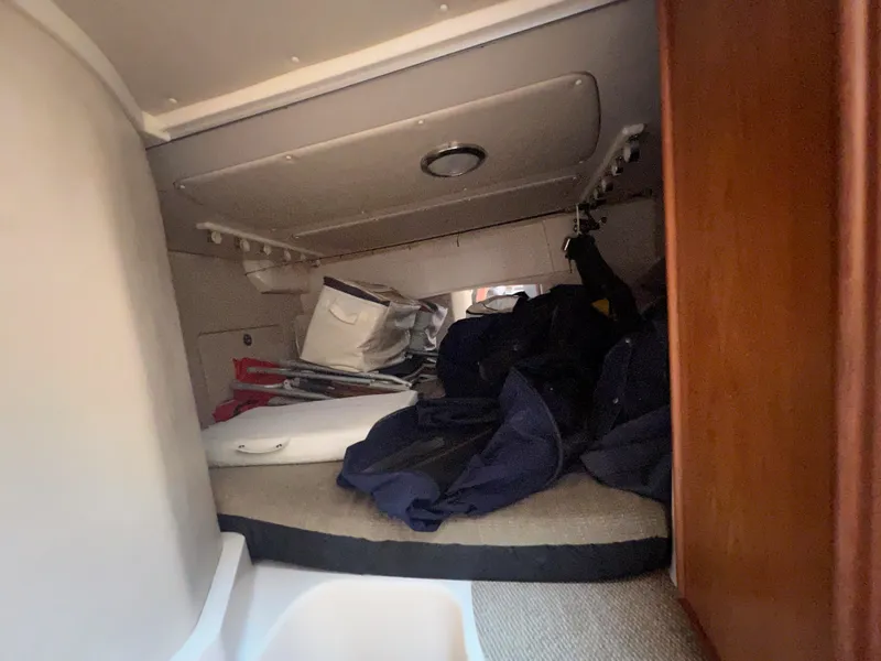 Slide: The Image of Interior cabin of 2006 Grady-White 360 Express boat with storage items. - 17