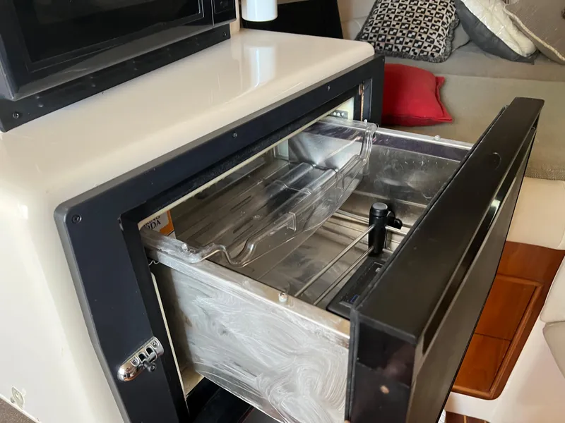 Slide: The Image of Open drawer in 2006 Grady-White 360 Express boat interior, showcasing storage space. - 24
