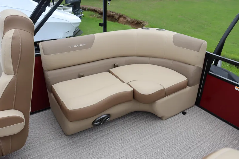 Slide: The Image of 2022 Veranda VR20 RC boat interior with beige and brown cushioned seating. - 10