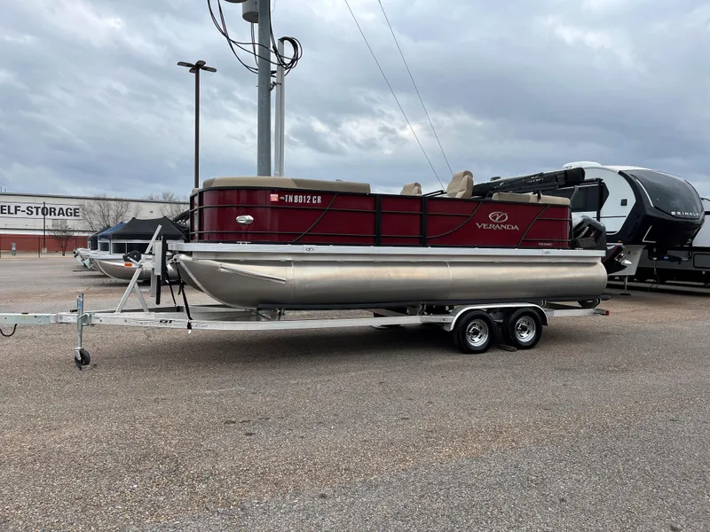 Slide: The Image of 2022 Veranda VR20 RC pontoon boat on trailer in parking lot. - 13
