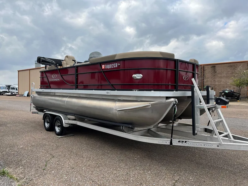 Slide: The Image of 2022 Veranda VR20 RC pontoon boat on trailer under cloudy sky. - 14