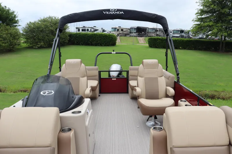 Slide: The Image of 2022 Veranda VR20 RC pontoon boat with beige seating and black canopy. - 3