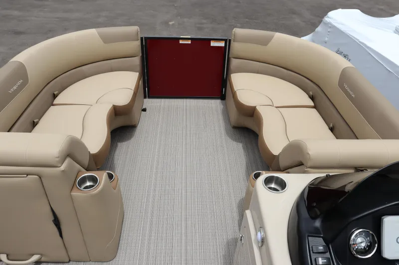Slide: The Image of 2022 Veranda VR20 RC pontoon boat interior with beige seating and cup holders. - 4