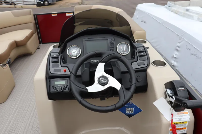 Slide: The Image of 2022 Veranda VR20 RC boat dashboard with steering wheel and control panel. - 8