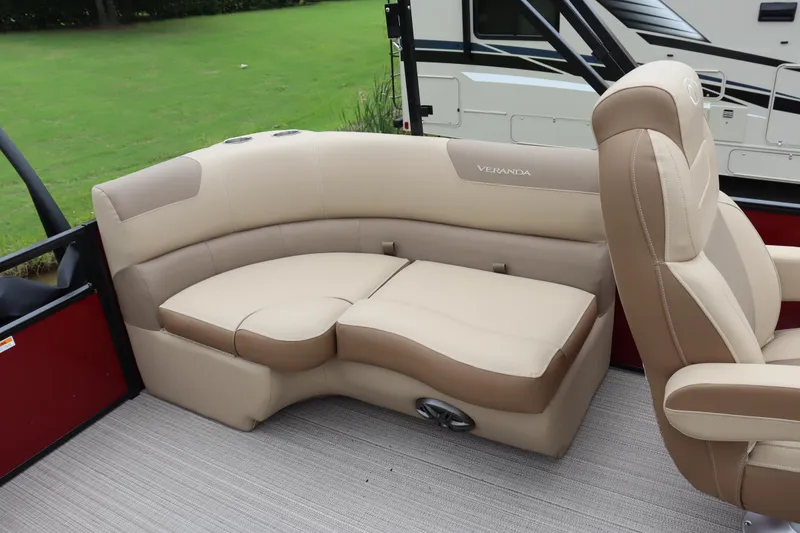 Slide: The Image of 2022 Veranda VR20 RC boat interior with beige seating and red accents. - 9