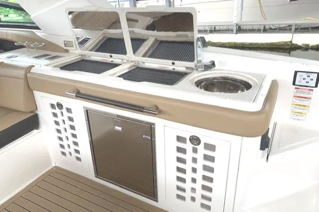 Slide: The Image of Wet bar w/refrigerator, wine cooler, dual grills and sink - 15