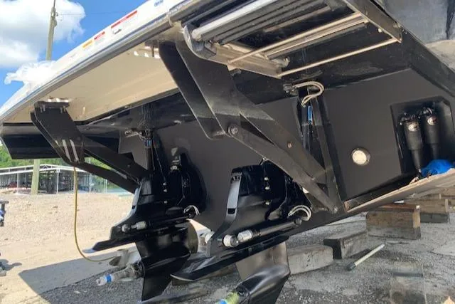 Slide: The Image of 2020 Sea Ray 400 SLX boat underside with dual propellers and trim tabs. - 45