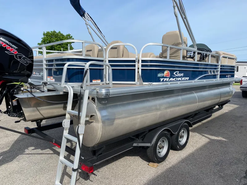 The Image of 2020 Sun Tracker SportFish 22 DLX pontoon boat on trailer. - 0