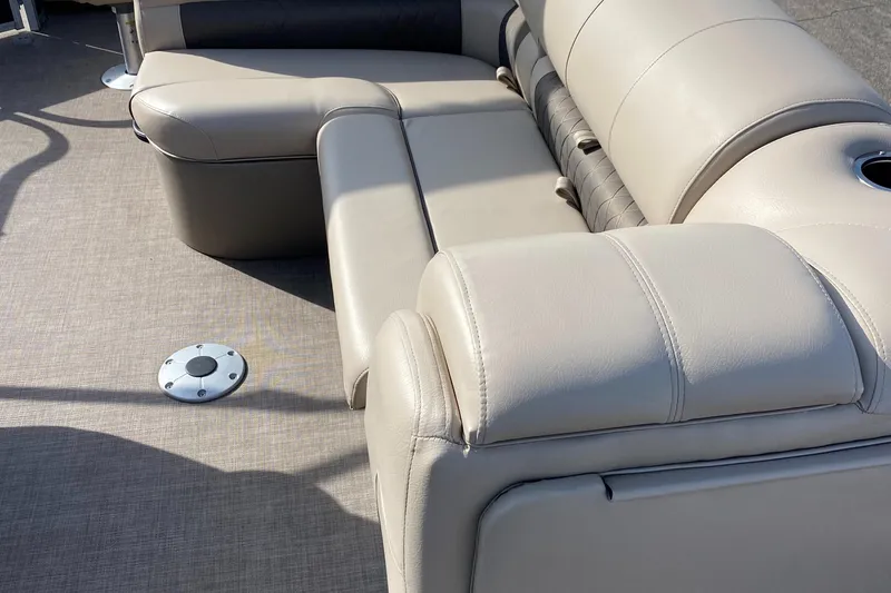 Slide: The Image of 2020 Sun Tracker SportFish 22 DLX boat interior with beige seating. - 14