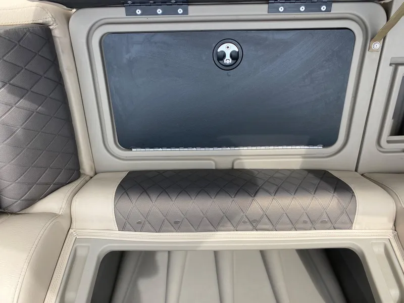 Slide: The Image of Sun Tracker SportFish 22 DLX 2020 boat storage compartment and seating. - 20