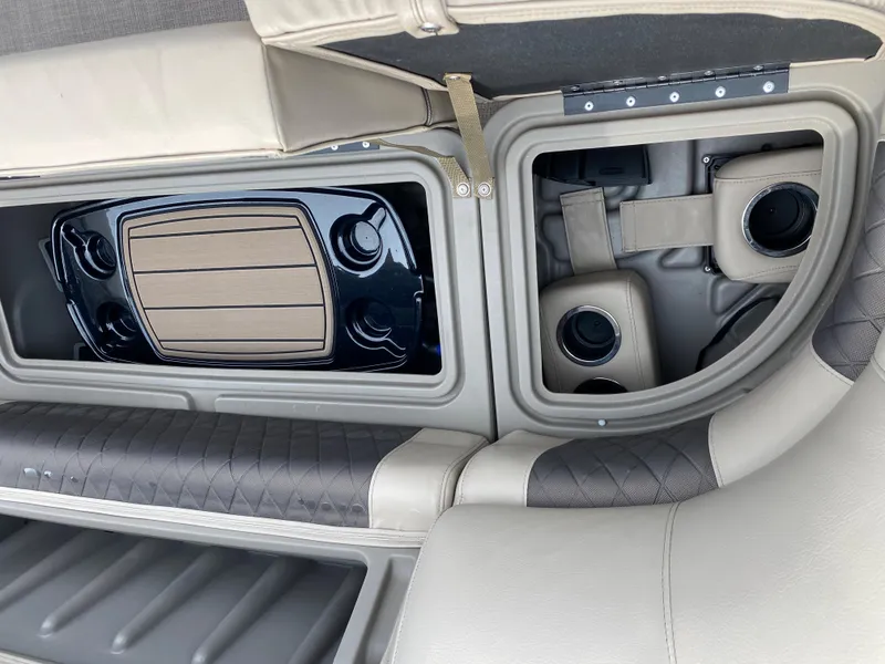 Slide: The Image of 2020 Sun Tracker SportFish 22 DLX storage compartments and cup holders. - 23
