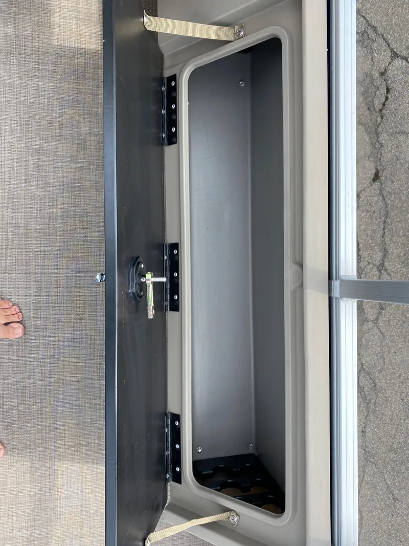 Slide: The Image of Storage compartment of 2020 Sun Tracker SportFish 22 DLX pontoon boat. - 26