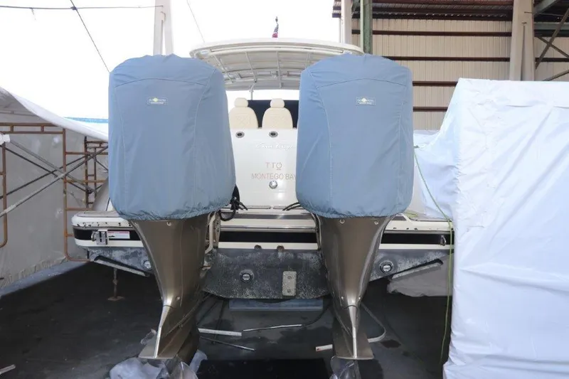 Slide: The Image of 2017 Chris-Craft 35 Catalina with covered outboard motors in storage. - 11