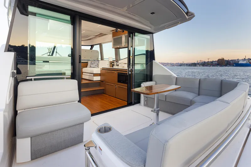 Slide: The Image of Luxurious 2023 Tiara Yachts 49 COUPE with elegant interior and scenic water view. - 15