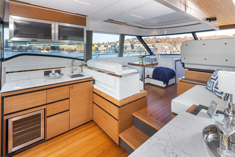 Slide: The Image of Luxurious interior of 2023 Tiara Yachts 49 COUPE with modern kitchen and seating area. - 18