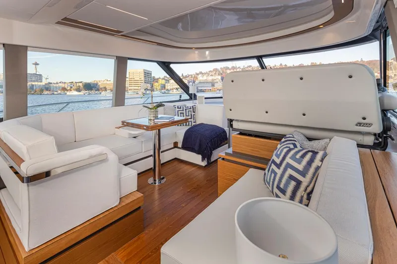 Slide: The Image of Luxurious interior of 2023 Tiara Yachts 49 COUPE with elegant seating and scenic views. - 19
