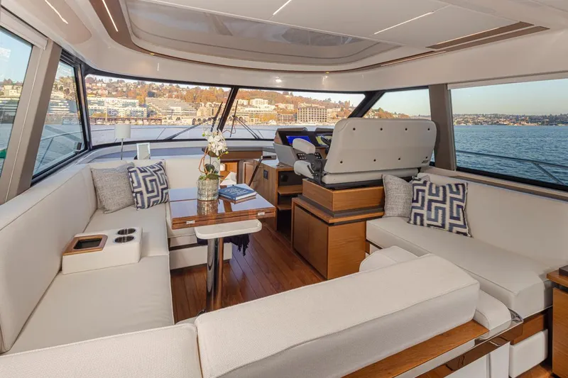 Slide: The Image of Luxurious interior of 2023 Tiara Yachts 49 COUPE with elegant seating and scenic views. - 20