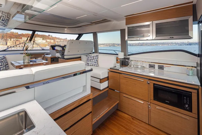 Slide: The Image of Luxurious interior of 2023 Tiara Yachts 49 COUPE with modern kitchen and seating area. - 21