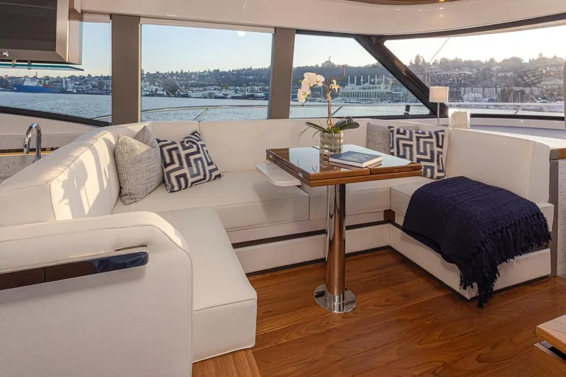 Slide: The Image of Luxurious interior of 2023 Tiara Yachts 49 COUPE with elegant seating and scenic views. - 23