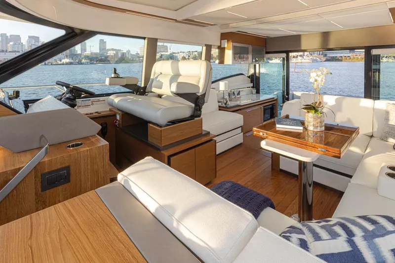 Slide: The Image of Luxurious interior of 2023 Tiara Yachts 49 COUPE with waterfront view. - 24