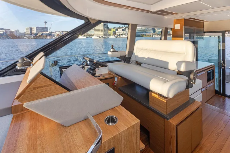 Slide: The Image of Luxurious interior of 2023 Tiara Yachts 49 COUPE with waterfront view. - 25