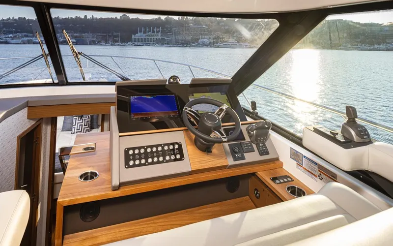 Slide: The Image of Interior of 2023 Tiara Yachts 49 COUPE, featuring modern helm and scenic water view. - 28