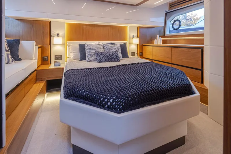 Slide: The Image of Luxurious bedroom interior of 2023 Tiara Yachts 49 COUPE with modern design and cozy bedding. - 36