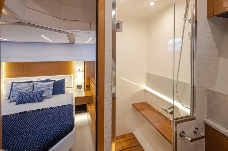 Slide: The Image of Luxurious 2023 Tiara Yachts 49 COUPE interior with elegant bedroom and modern bathroom. - 39