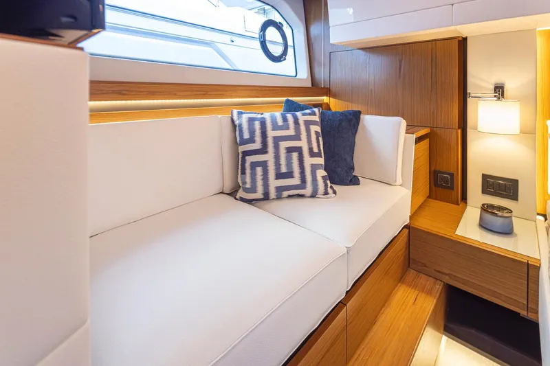 Slide: The Image of Luxurious interior of 2023 Tiara Yachts 49 COUPE with elegant seating and cushions. - 43