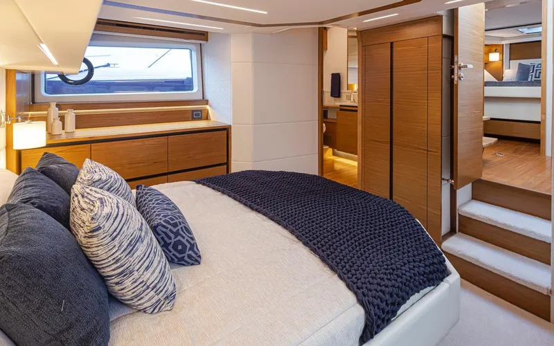 Slide: The Image of Luxurious bedroom interior of 2023 Tiara Yachts 49 COUPE with modern design and cozy bedding. - 44