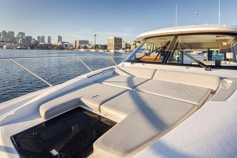 Slide: The Image of 2023 Tiara Yachts 49 COUPE on water with city skyline in background. - 48
