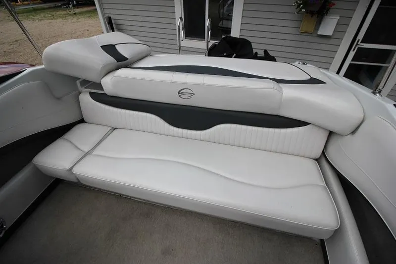 Slide: The Image of 2015 Crownline 21 SS boat interior with white and black seating. - 16