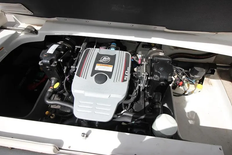Slide: The Image of 2015 Crownline 21 SS boat engine compartment with 5.0L MerCruiser engine. - 17