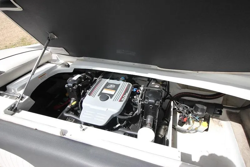Slide: The Image of 2015 Crownline 21 SS boat engine compartment with open hatch. - 18