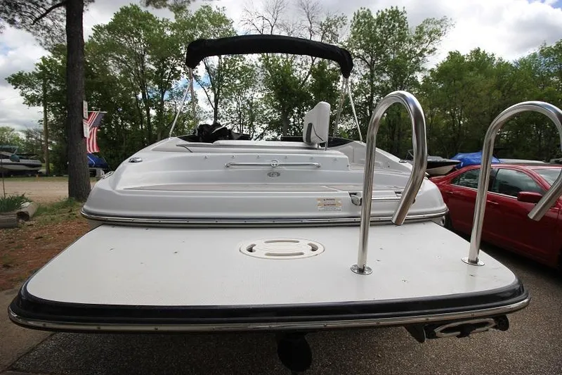 Slide: The Image of 2015 Crownline 21 SS boat rear view with swim platform and ladder. - 3