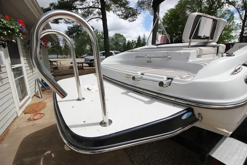 Slide: The Image of 2015 Crownline 21 SS boat with swim platform and ladder. - 5