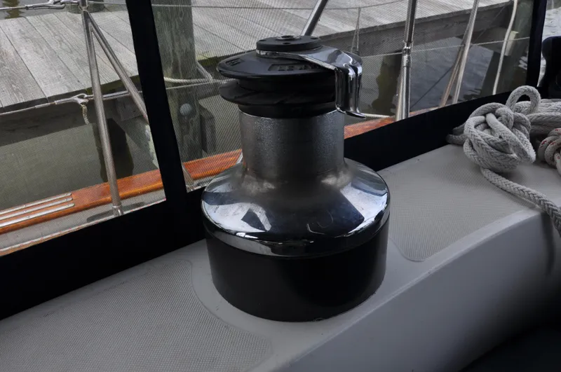 Slide: The Image of Winch on 1988 Tayana 52 sailboat deck with ropes and netting. - 22