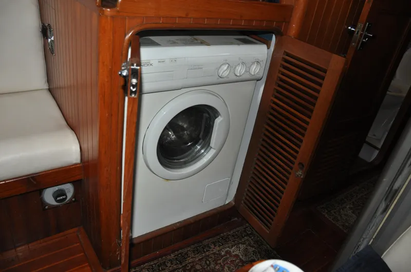 Slide: The Image of Washing machine in the wooden interior of a 1988 Tayana 52 yacht. - 40
