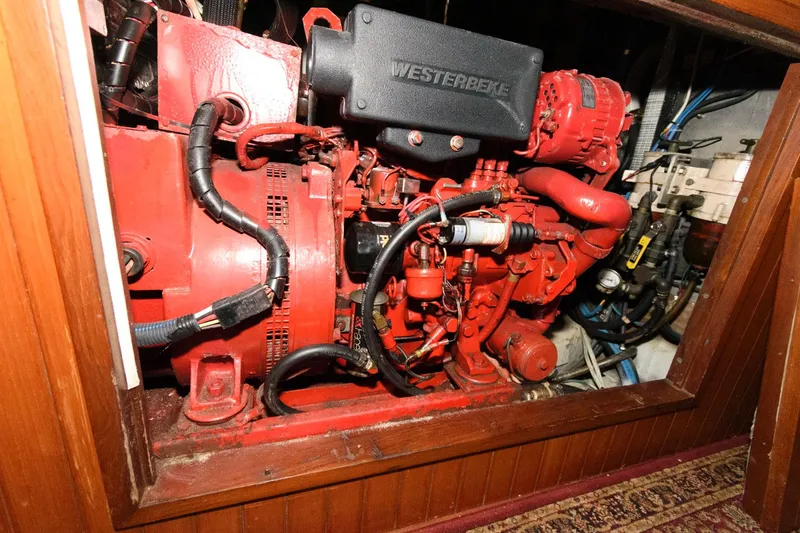 Slide: The Image of Engine compartment of a 1988 Tayana 52 sailboat with a Westerbeke engine. - 42