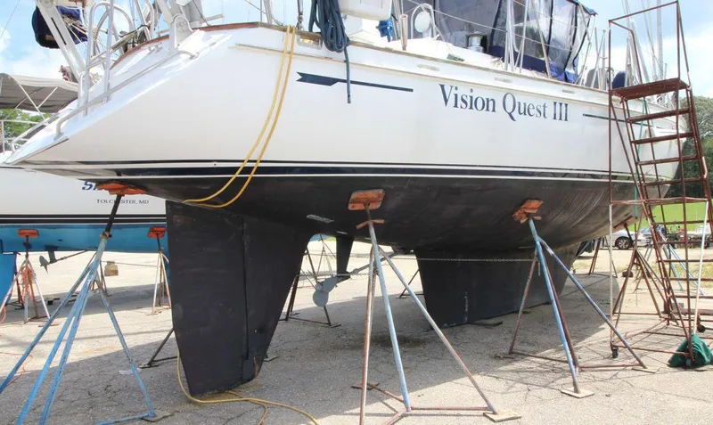 Slide: The Image of 1988 Tayana 52 sailboat "Vision Quest III" on dry dock with support stands. - 43