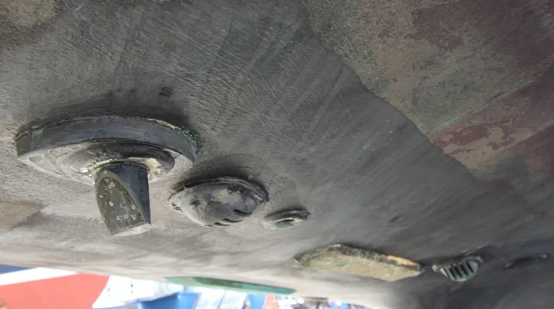 Slide: The Image of Underside view of 1988 Tayana 52 sailboat hull with fittings and marine growth. - 45