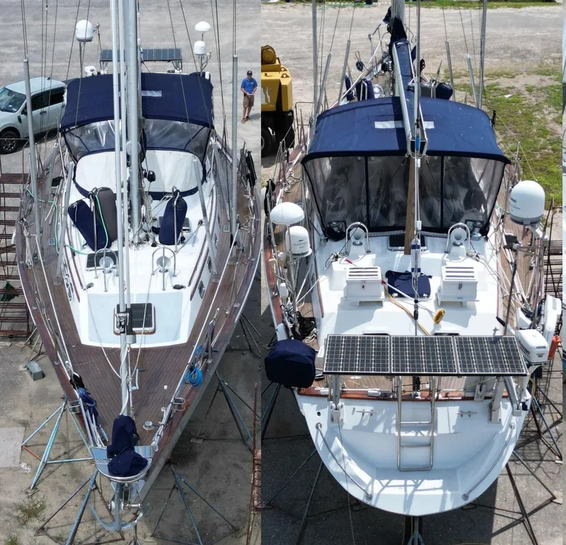 Slide: The Image of Two Tayana 52 sailboats from 1988 on stands, with blue covers and solar panels. - 5