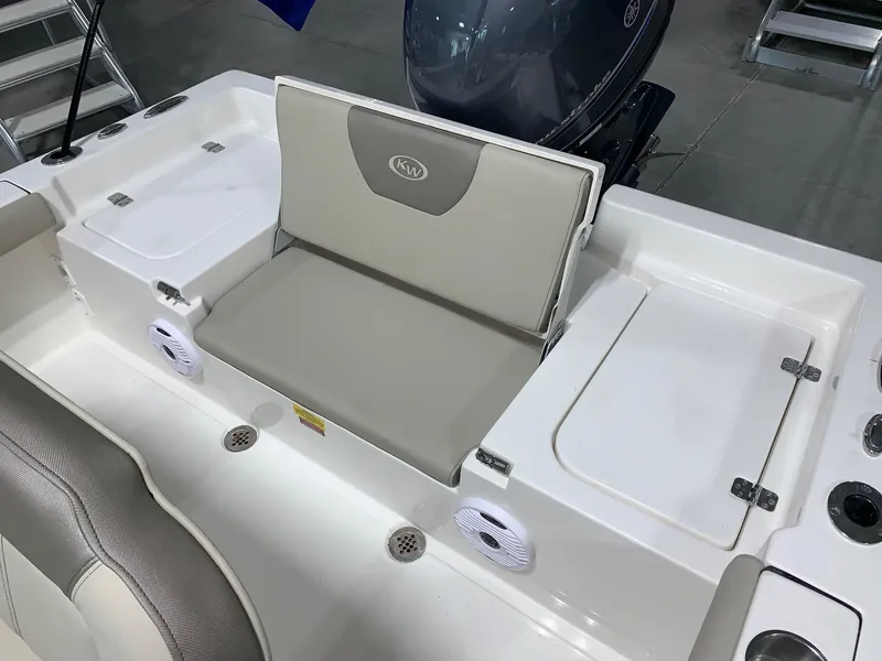 Slide: The Image of 2024 Key West 179 FS boat interior with seating and storage compartments. - 13