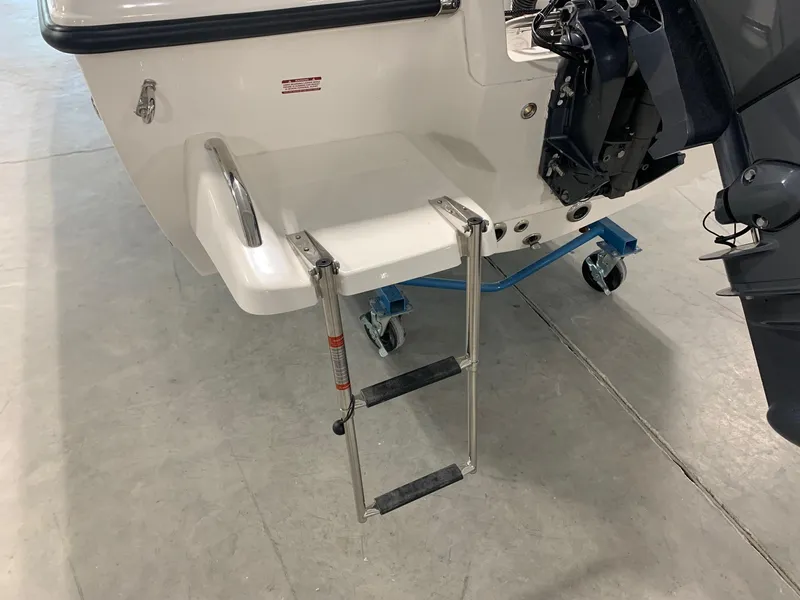 Slide: The Image of 2024 Key West 179 FS boat with a foldable swim ladder. - 3