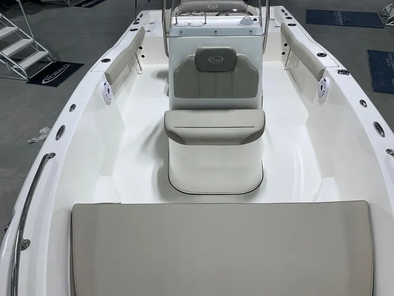 Slide: The Image of 2024 Key West 179 FS boat interior with cushioned seating and center console. - 4