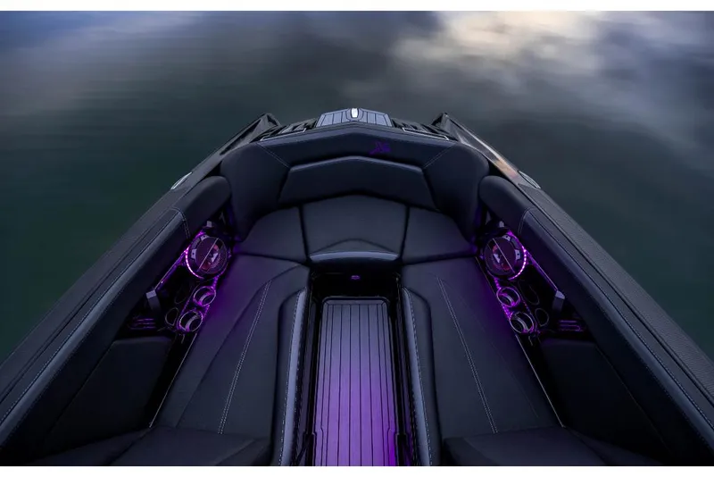 Slide: The Image of 2023 MasterCraft XStar S Piranha boat interior with purple LED lighting. - 8